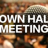 A microphone overlayed with town hall meeting text